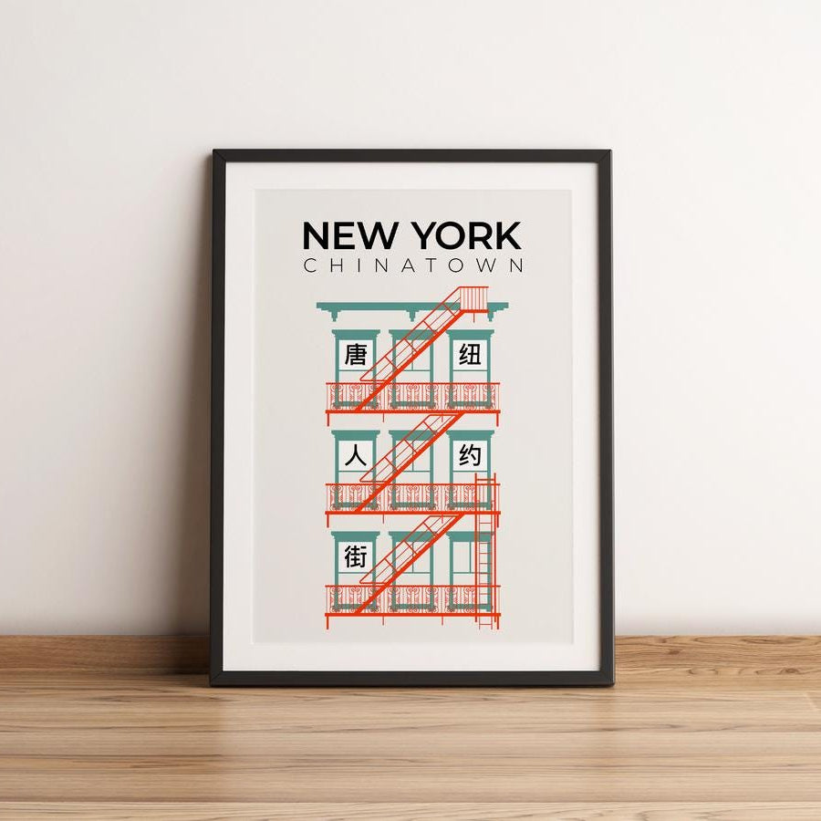 Framed poster of a building with 'New York Chinatown' text on a white wall.